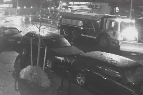 This still from a security camera shows the Sanitation truck a city worker was driving when he fatally struck a pedestrian on Tuesday morning.